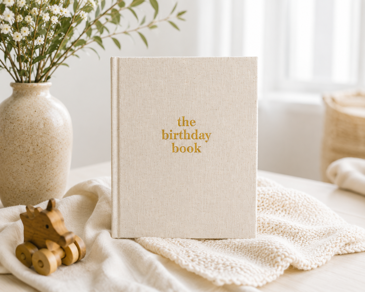 The Birthday Book heirloom keepsake journal with linen cover and gold foil lettering · The Birthday Book open to a birthday memory page with writing prompts · The Birthday Book interior pages showing letter and memory sections · The Birthday Book premium keepsake journal for recording 18 years of birthdays · The Birthday Book linen cover detail with gold accent lettering · The Birthday Book lay-flat binding for easy writing · The Birthday Book archival acid-free pages for lasting memories · The Birthday Boo